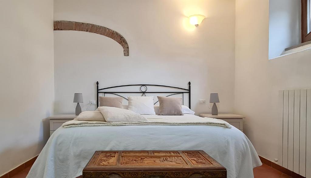 Łóżko lub łóżka w pokoju w obiekcie Agriturismo Barbadoro
