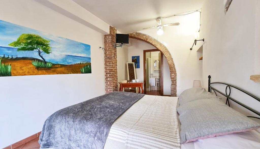 Łóżko lub łóżka w pokoju w obiekcie Agriturismo Barbadoro