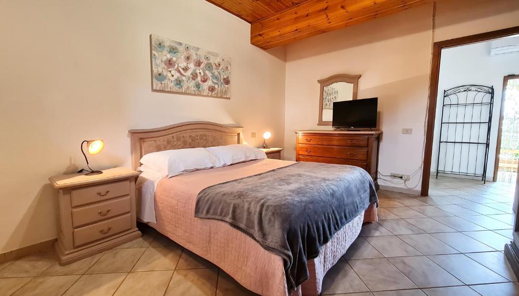 Łóżko lub łóżka w pokoju w obiekcie Agriturismo Barbadoro
