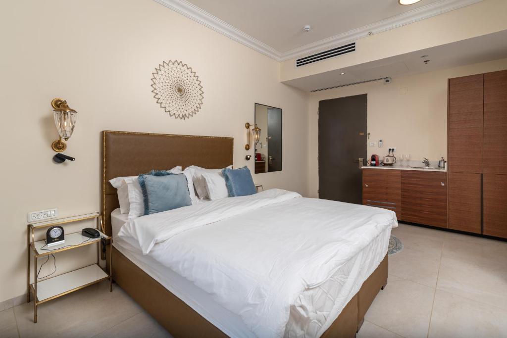 Postel nebo postele na pokoji v ubytování Amirey Hagalil Boutique Hotel