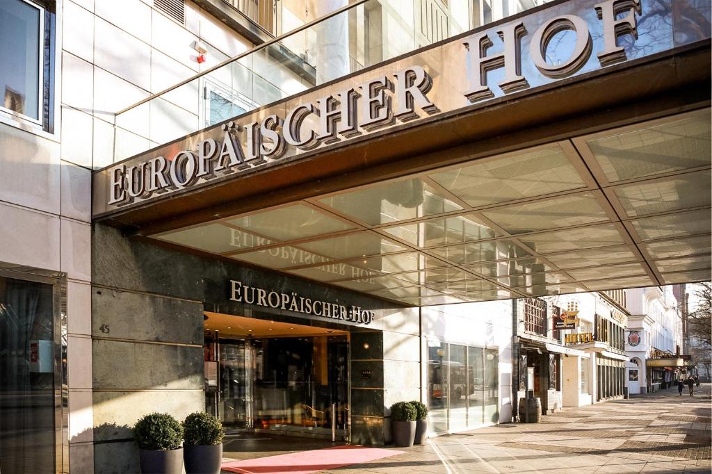 a store front of a building with a sign on it at Hotel Europäischer Hof Hamburg in Hamburg