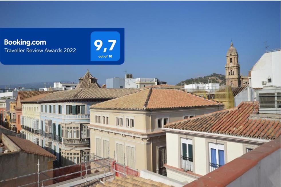 a view of a city with roofs at Calle Cinteria in Málaga