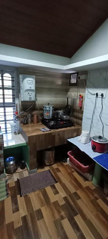 Kuchyň nebo kuchyňský kout v ubytování Doddakallu Betta Homestay Coorg