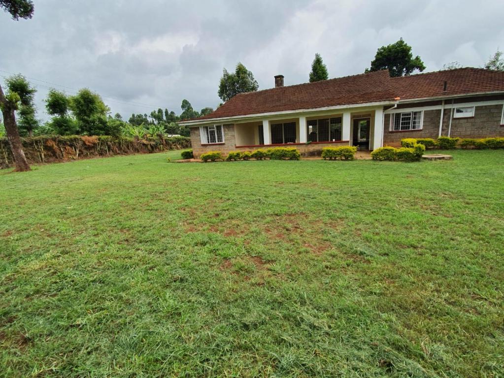 a large yard in front of a house at Thayo Place in Nyeri