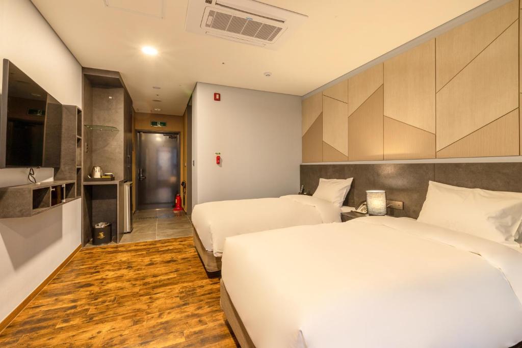 Postel nebo postele na pokoji v ubytování Urban-Est Hotel