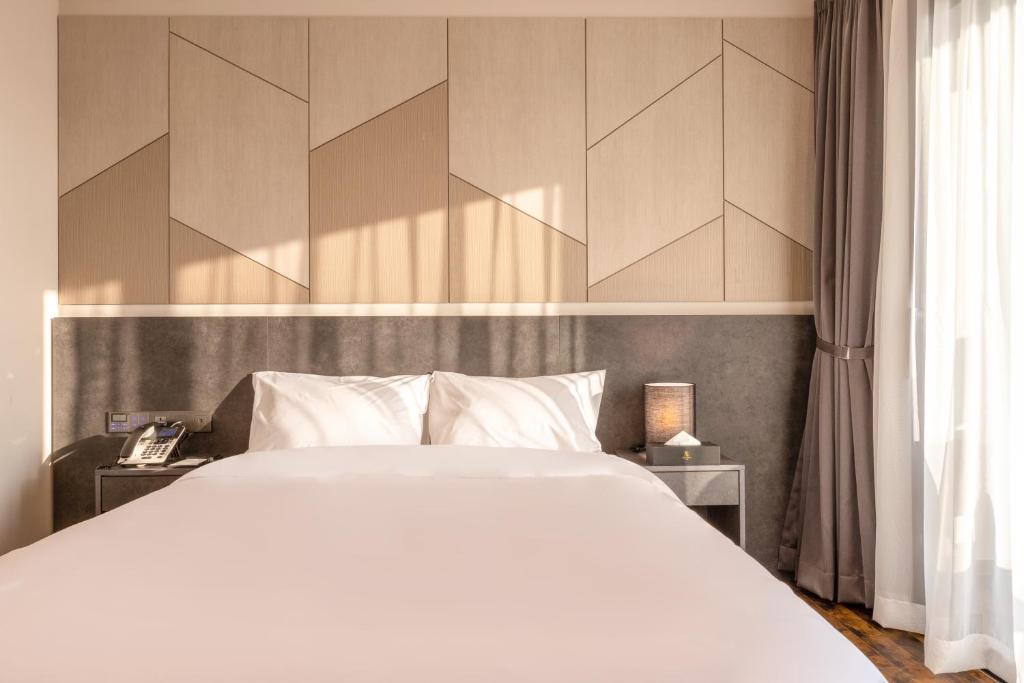 Postel nebo postele na pokoji v ubytování Urban-Est Hotel
