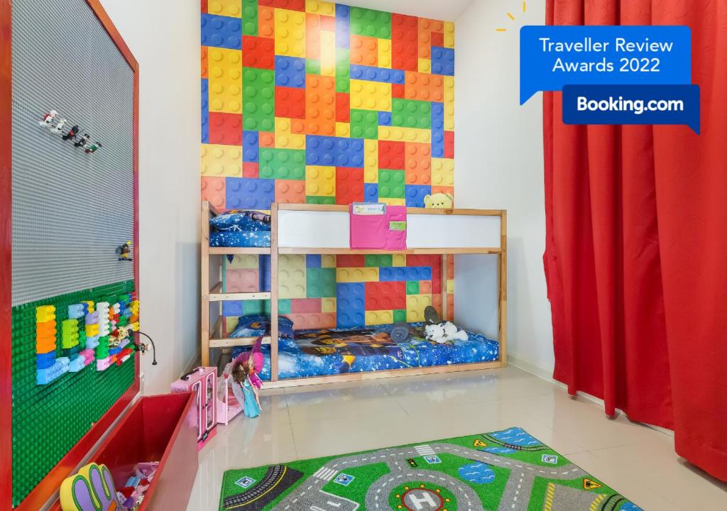 a childs bedroom with a wall made out of legos at Legoland Fun- Hostahome Suites at D'Pristine Residence in Nusajaya