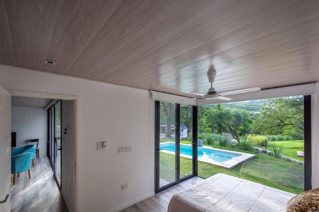 a house with a view of a swimming pool at Casa en Potrerillo de Larreta in Alta Gracia