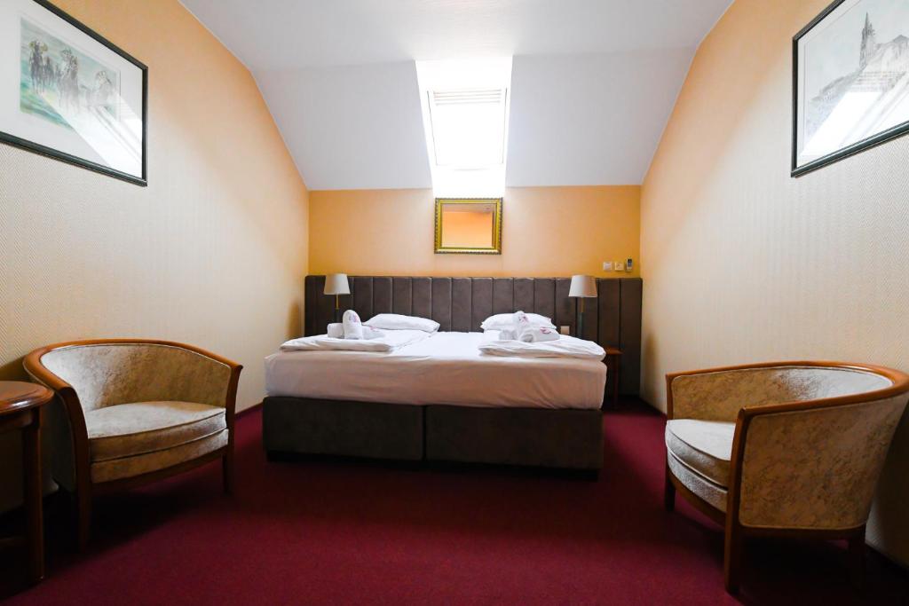 Łóżko lub łóżka w pokoju w obiekcie Pensjonat Fitness & Spa Gregor