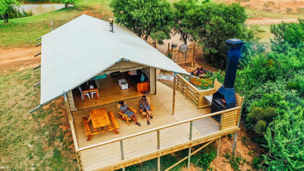 an overhead view of a house with people sitting on a deck at AfriCamps at Kam'Bati in Swellendam