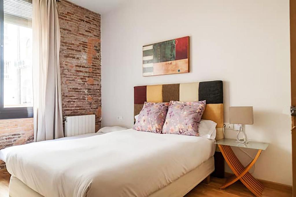 Posteľ alebo postele v izbe v ubytovaní Bcn-rentals apartments in the Old town