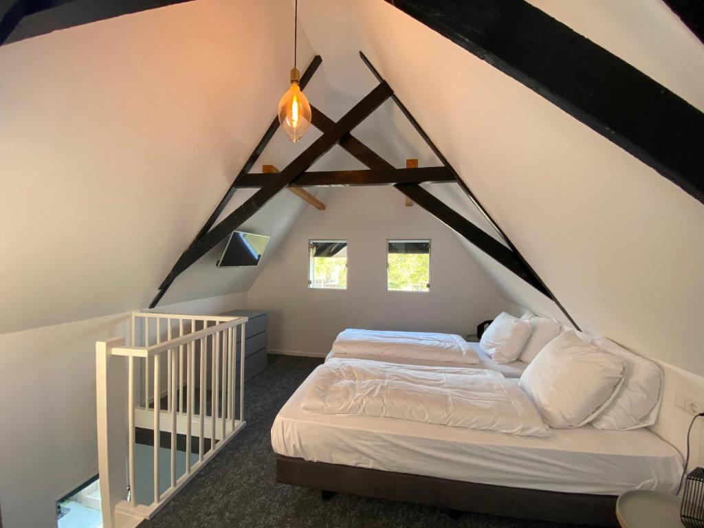 Postel nebo postele na pokoji v ubytování Hotel Restaurant De Stadsherberg