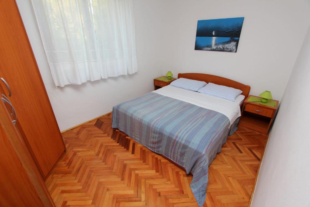 Posteľ alebo postele v izbe v ubytovaní Apartments Lara
