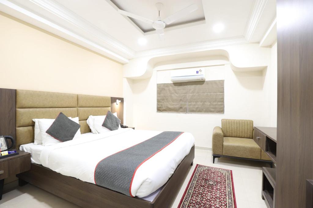 Postel nebo postele na pokoji v ubytování Alba Premier, Ahmedabad