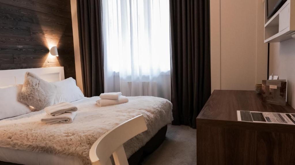 Postel nebo postele na pokoji v ubytování Chalet hôtel le Whymper