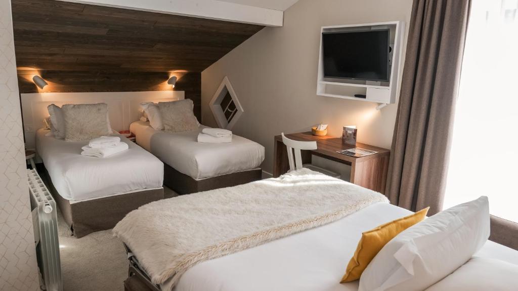 Postel nebo postele na pokoji v ubytování Chalet hôtel le Whymper