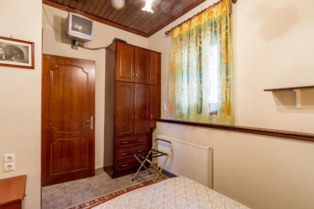 Posteľ alebo postele v izbe v ubytovaní Konstas Stone Island House in Meganisi