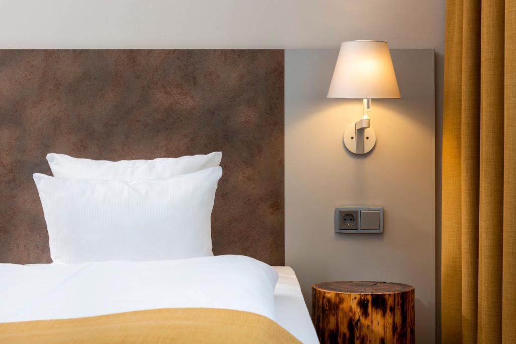 Postel nebo postele na pokoji v ubytování SORAT Hotel Berlin