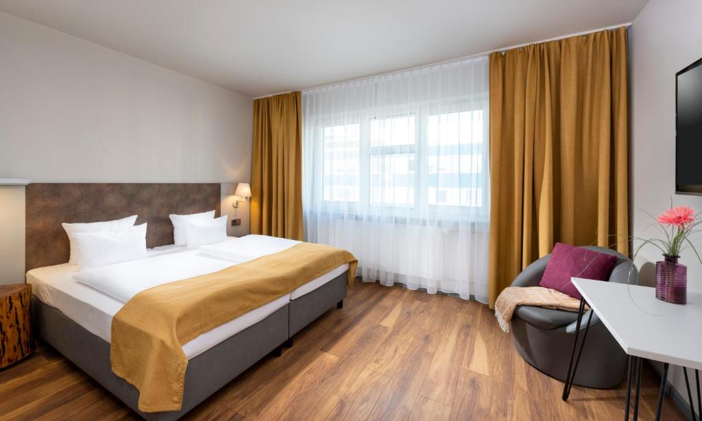 Postel nebo postele na pokoji v ubytování SORAT Hotel Berlin