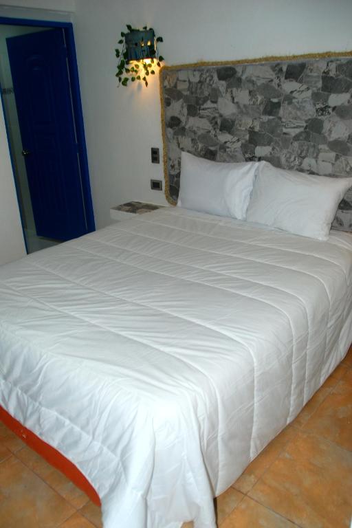 Postel nebo postele na pokoji v ubytování Nuovo Hotel Playa Catalina