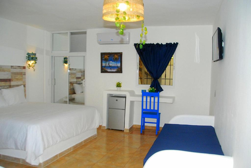 Postel nebo postele na pokoji v ubytování Nuovo Hotel Playa Catalina