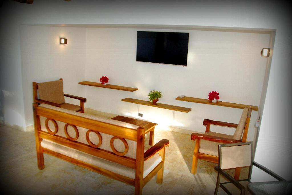 TV a/nebo společenská místnost v ubytování Nuovo Hotel Playa Catalina