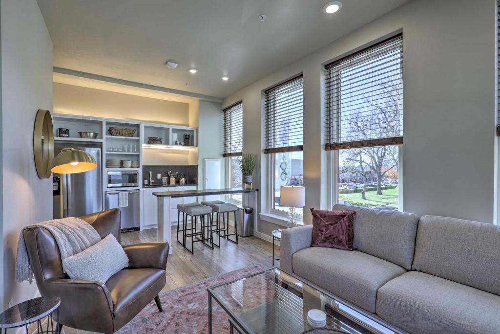 a living room with a couch and a bar at Stylish San Marcos Apt in the Heart of Dwtn! in San Marcos