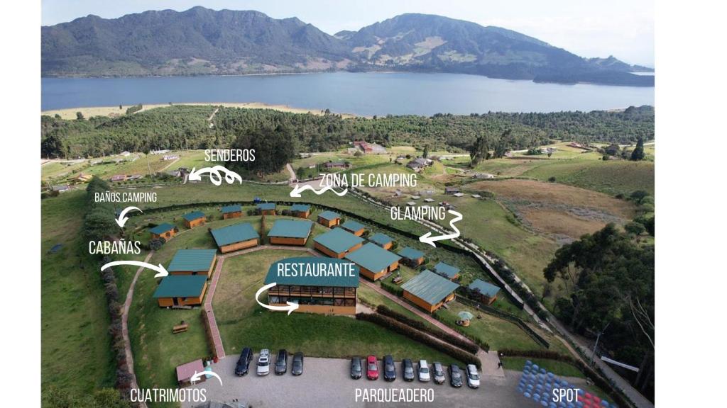 an aerial view of a resort with a lake at Refugio del Neusa in Cogua