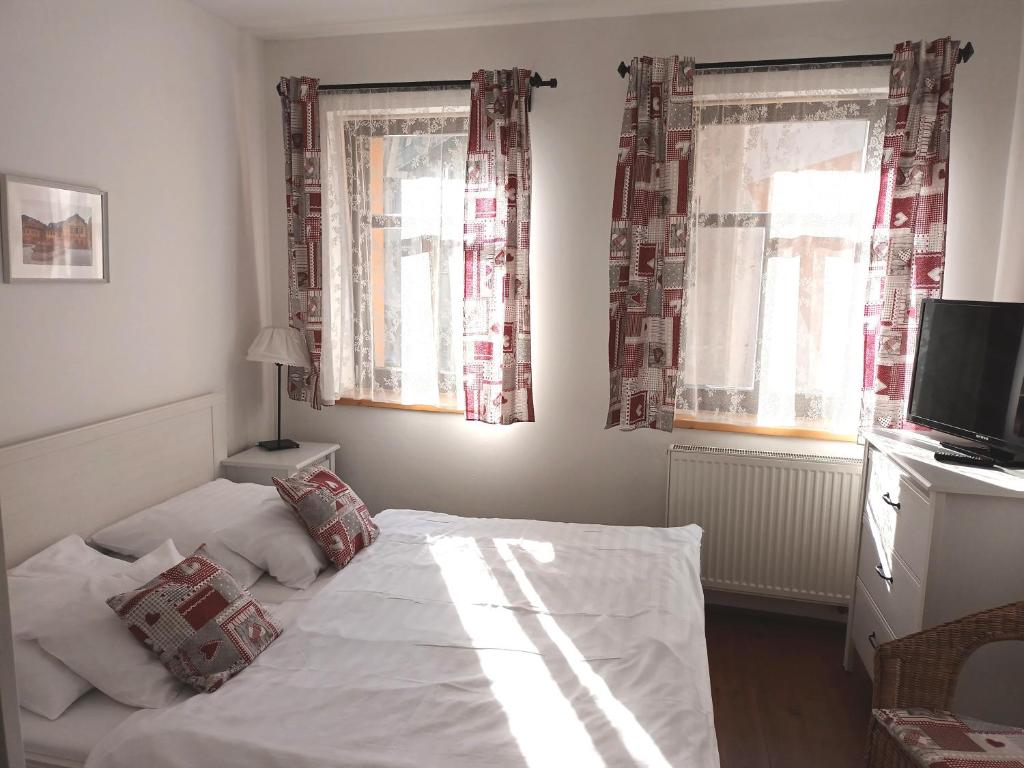 Postel nebo postele na pokoji v ubytování Hotel Střelnice