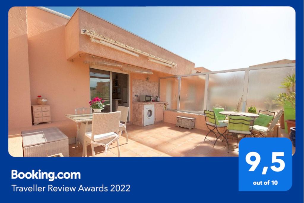 a picture of a patio with a table and chairs at Maxime plage in Sainte-Maxime