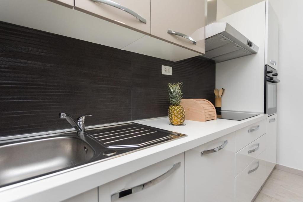 Kuchyň nebo kuchyňský kout v ubytování Bloom Apartment