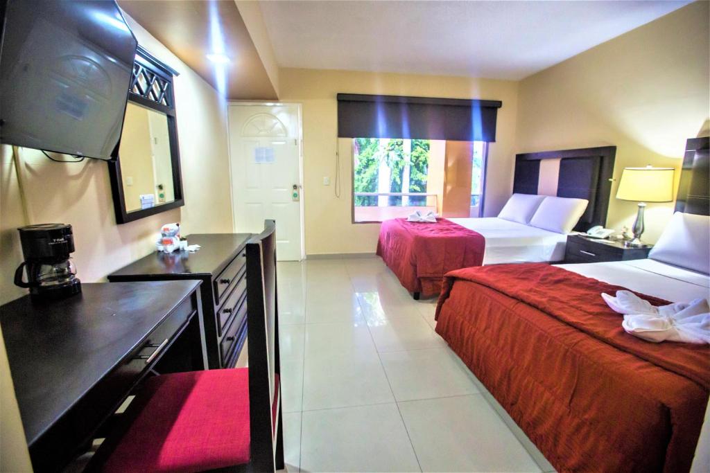 Postel nebo postele na pokoji v ubytování Hotel Plaza Mirador