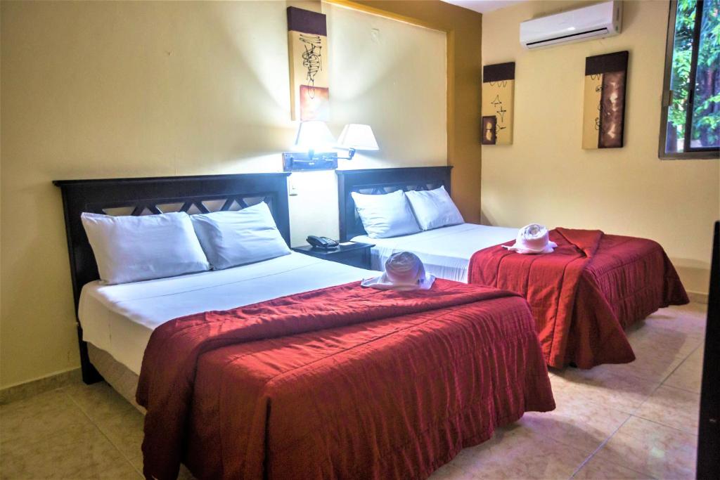 Postel nebo postele na pokoji v ubytování Hotel Plaza Mirador