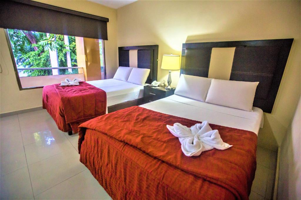 Postel nebo postele na pokoji v ubytování Hotel Plaza Mirador