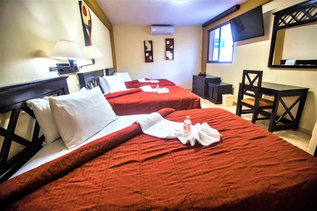 Postel nebo postele na pokoji v ubytování Hotel Plaza Mirador