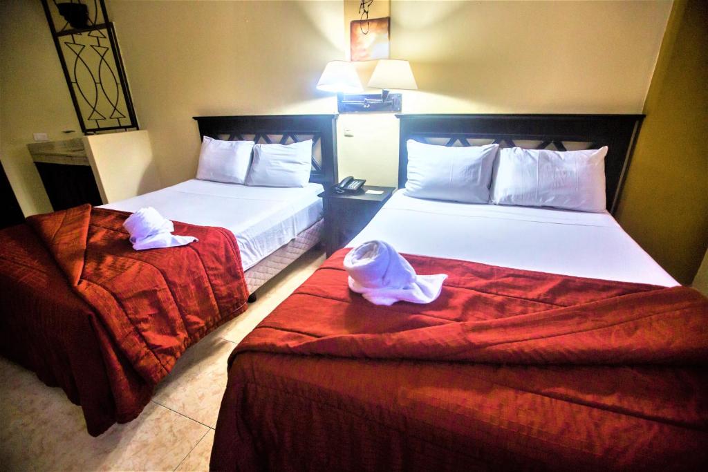 Postel nebo postele na pokoji v ubytování Hotel Plaza Mirador