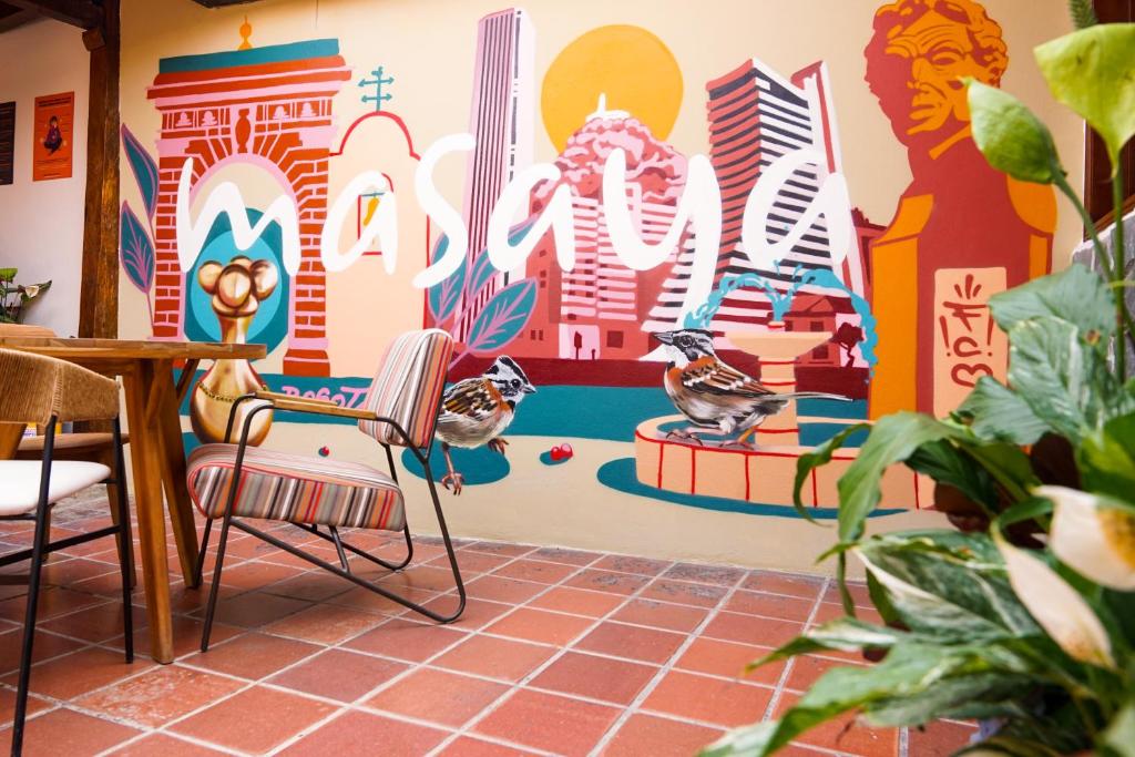 a living room filled with lots of colorful furniture at Masaya Bogotá in Bogotá