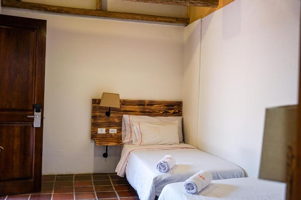 Postel nebo postele na pokoji v ubytování Masaya Bogotá