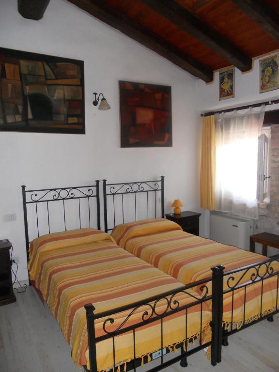 Postel nebo postele na pokoji v ubytování Albergo Julienne