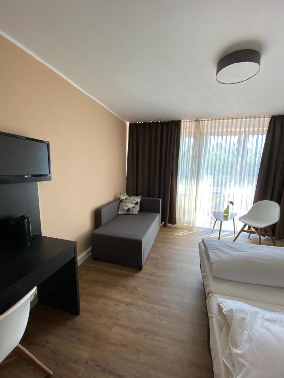 Postel nebo postele na pokoji v ubytování Hotel Drei Kronen