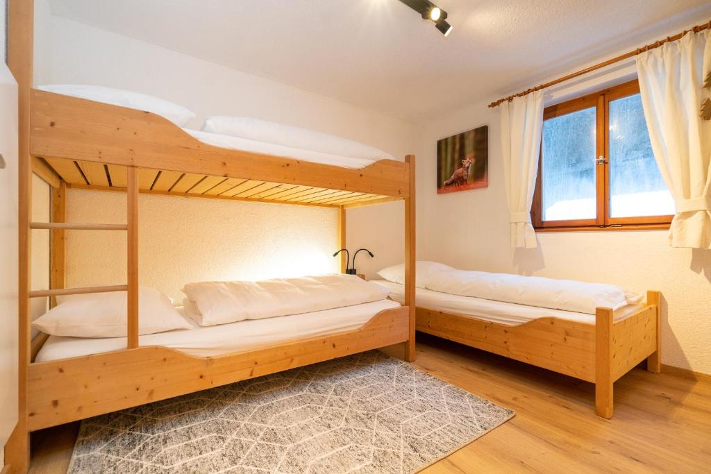 Postel nebo postele na pokoji v ubytování Haus Buachwald