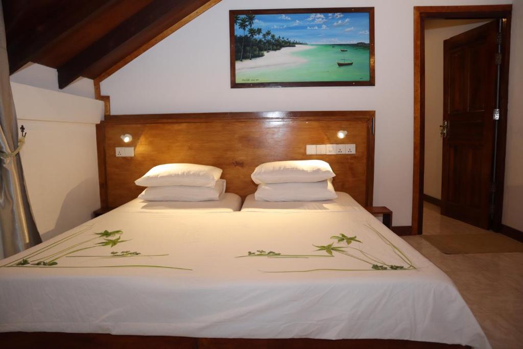 Postel nebo postele na pokoji v ubytování Masfalhi View Inn