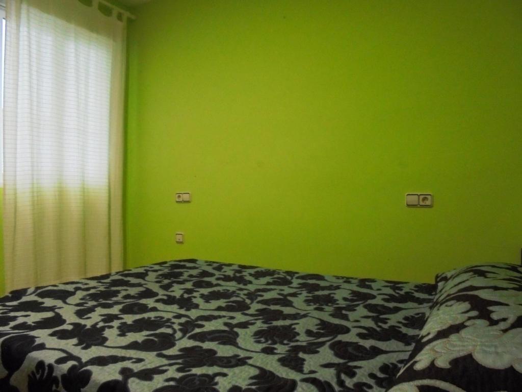 A bed or beds in a room at Llandels 21