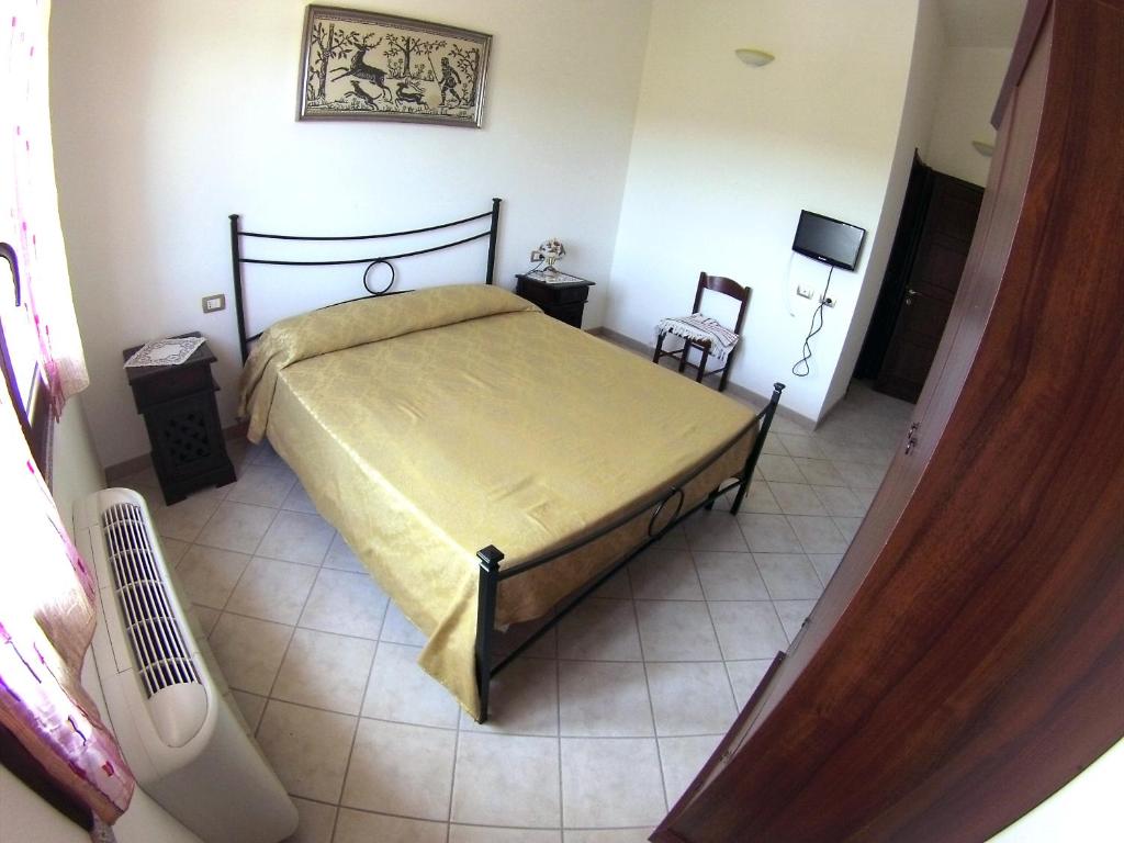 Postel nebo postele na pokoji v ubytování B&B Su Tintillu