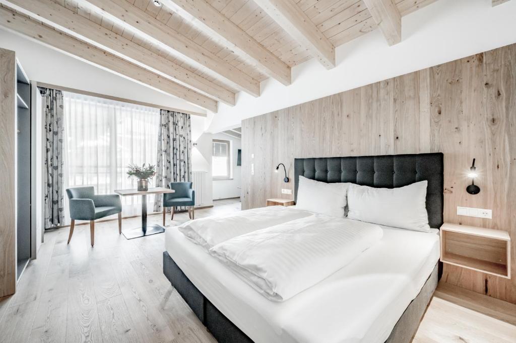 Postel nebo postele na pokoji v ubytování Sporthotel Olymp