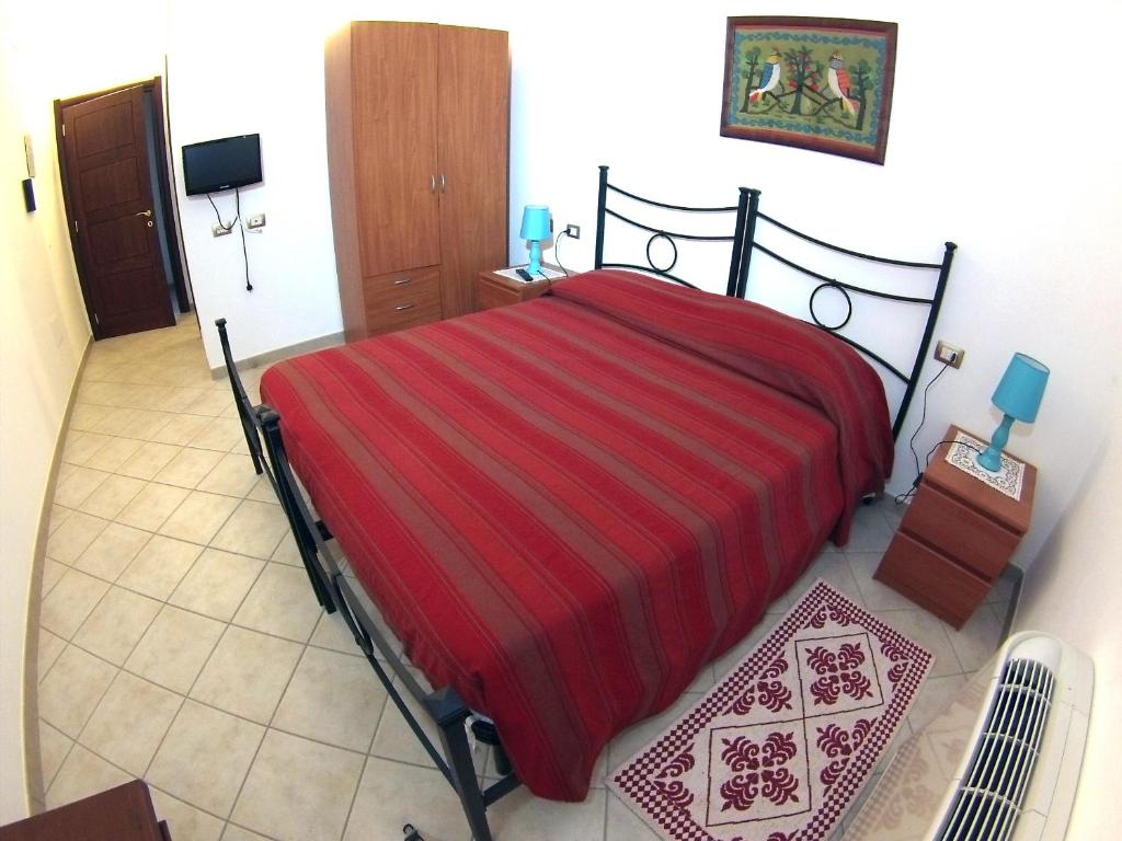 Postel nebo postele na pokoji v ubytování B&B Su Tintillu