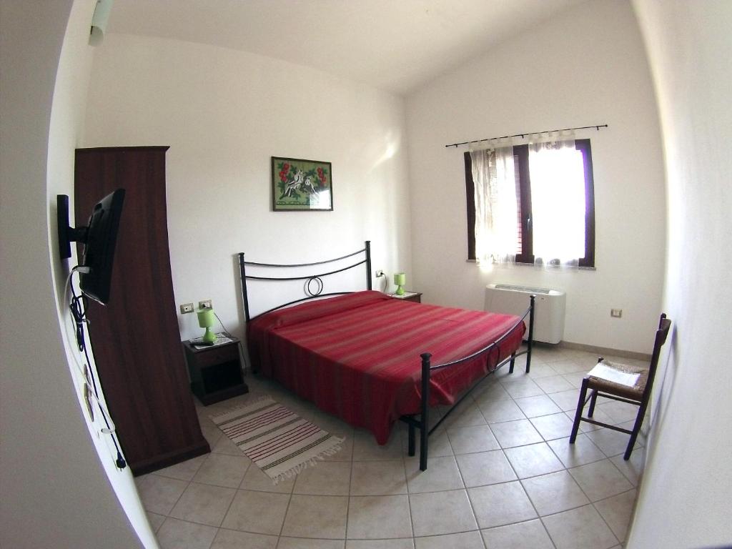 Postel nebo postele na pokoji v ubytování B&B Su Tintillu