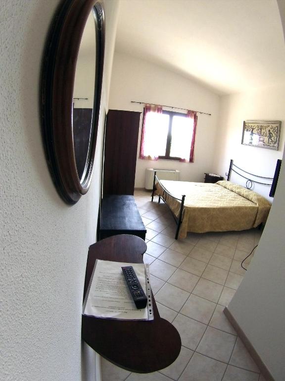 Postel nebo postele na pokoji v ubytování B&B Su Tintillu
