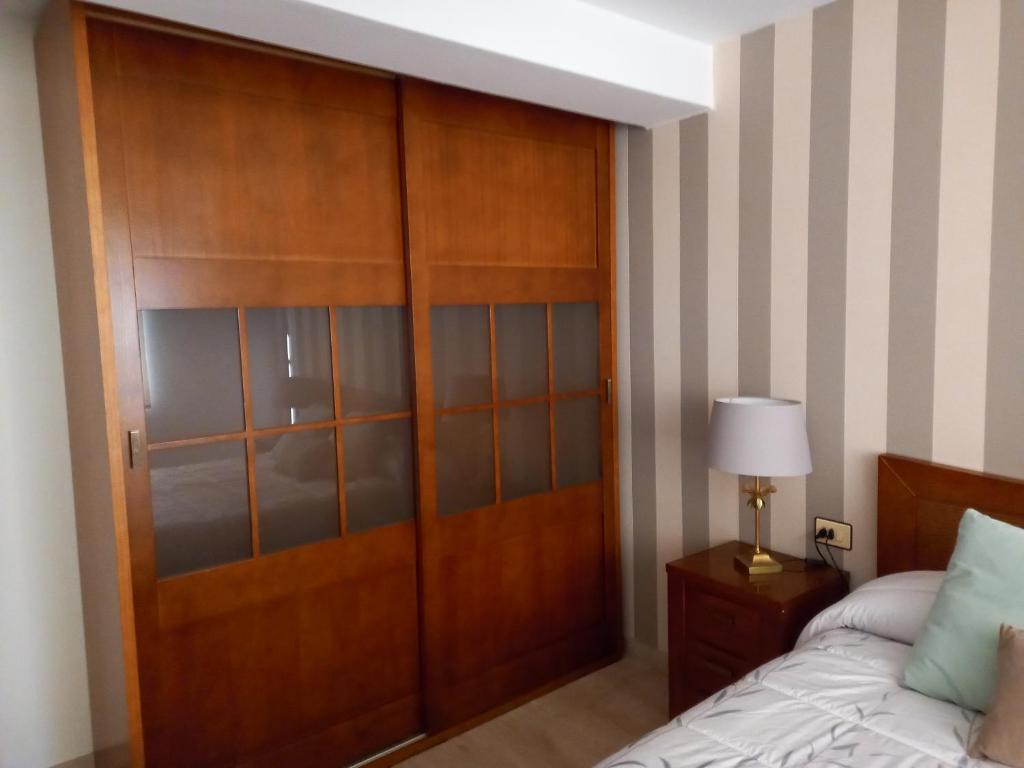 A bed or beds in a room at Apartamento a 350 metros de la playa