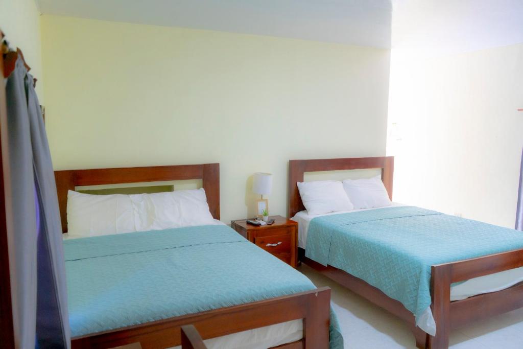 Postel nebo postele na pokoji v ubytování Hotel Anedi